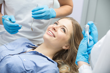 Dentist examining a patient's teeth in the dentist.