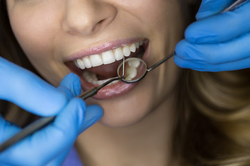 Dentist examining a patient's teeth in the dentist.