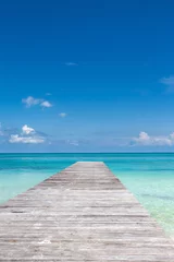 Foto op Plexiglas Wooden pier on tropical beach © photopixel