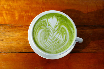 A cup of green tea matcha latte.