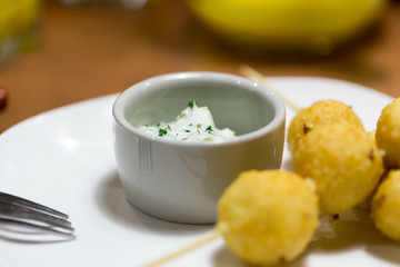 Cheese balls on wooden skewers