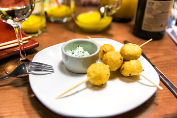 Cheese balls on wooden skewers