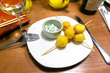Cheese balls on wooden skewers