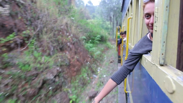 Girl peeking out of train 