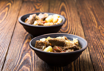 Beef stew with noodles and potatoes
