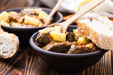 Beef stew with noodles and potatoes