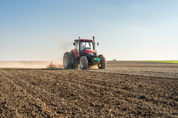 Tractor preparing land