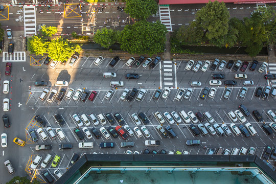 Car parking lot viewed from above in the evening