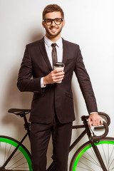 Young businessman with bicycle