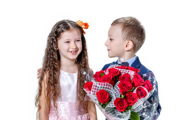 boy gives a girl flowers on the day of St . Valentine