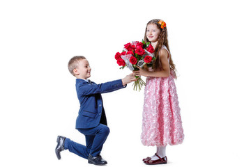 boy gives a girl flowers on the day of St . Valentine