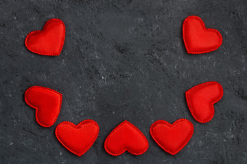 black background with frames of red hearts