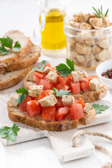bread with tomatoes and marinated feta, vertical