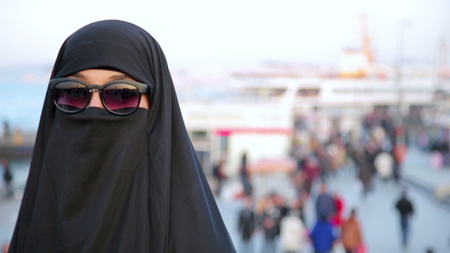 Steadycam, Woman with chador, hijab wearing sunglasses