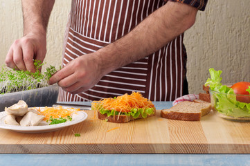 Man cooking big sandwich