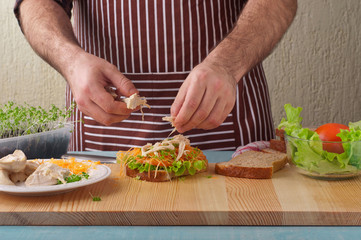 Man cooking big sandwich