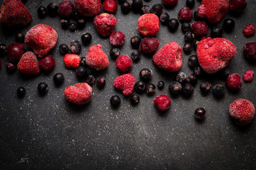 Frozen berries on dark background