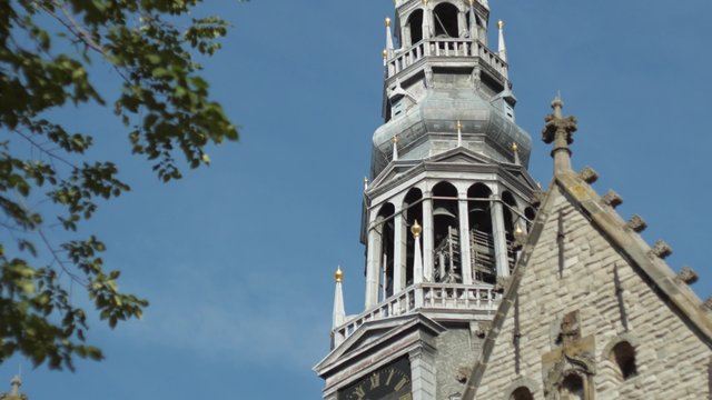 Tilt down the spire of De Oude Kerk in Amsterdam Shot in 4K