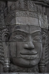 Fototapeta na wymiar abandoned temple with Cambodian gods idol statue
