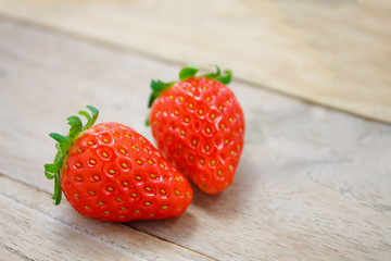 Fresh strawberries on wooden background