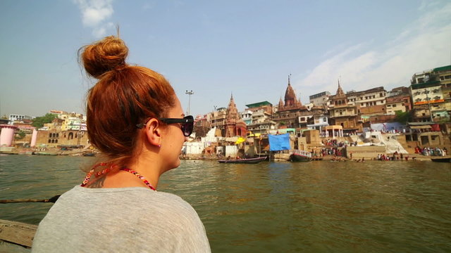 Caucasian tourist girl, indian boat, varanasi ganges river, india