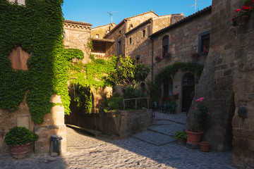 Long shadows of the old walls in the village Civita di Bagnoregi