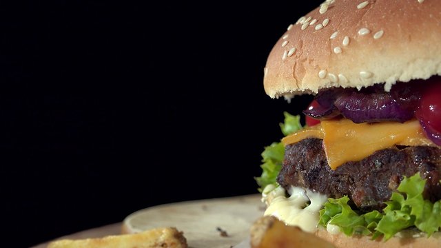 Homemade Cheeseburger as rotating seamless loopable 4K UHD footage