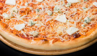 close-up of delicious pizza with different types of cheese