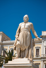 Fototapeta premium Statue of greek hero, Andreas Miaoulis, in front of the Town Hall of Ermoupolis, in Syros island, Aegean, Greece.