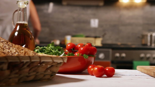 Woman on the countryside kitchen washed the broccoli before cooking
