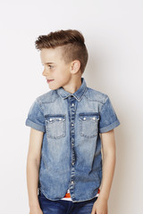 Cool young kid looking away, studio