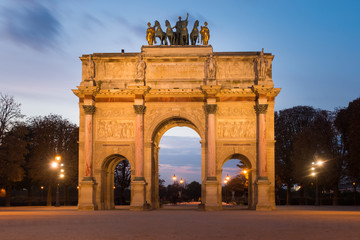 Fototapeta na wymiar Evening view of Arc de Triomphe du Carrousel on Place du Carrousel at the famous Museum Louvre