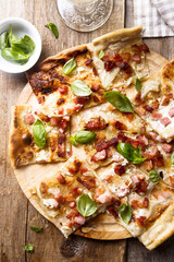 Flammkuchen pie with bacon and onion