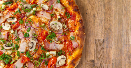 pizza with mushrooms on wooden table