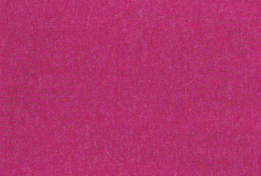 Pink knitted textile texture.