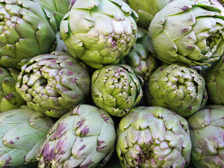 Fototapeta premium Some artichokes in a market. Natural vegetables.