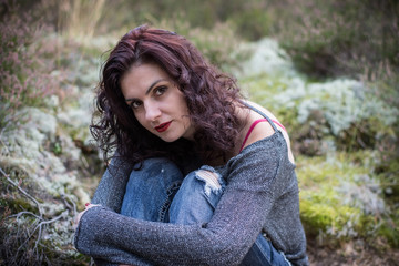 Beautiful woman in mossy forest