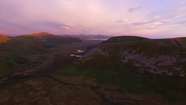 Aerial view of scenic valley on Andoya lit by midnight sun, Norway. Aerial 4k Ultra HD.