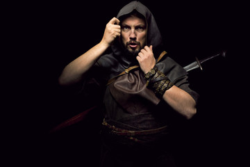 Fototapeta premium Viking warrior with sword over black background