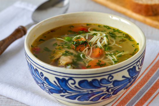 Homemade chicken soup on a table