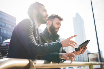 Half length of two young handsome caucasian bearded businessmen