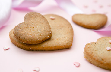 Sweet cookies in the shape of hearts for Valentine's Day on a pi