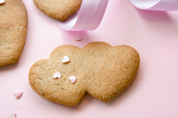 Sweet cookies in the shape of hearts for Valentine's Day on a pi