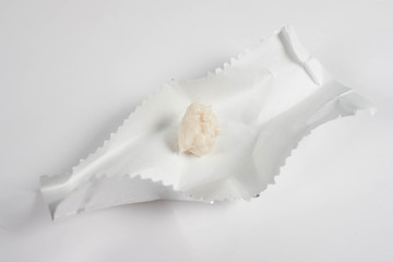 chewing gum is on the white background with paper. 