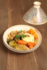 Couscous in a clay pot with drawings
