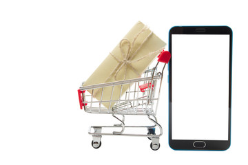 Online shopping concept - Empty Shopping Cart, laptop and tablet pc, smartphone isolated on white background. Copy space for text.