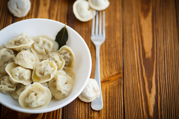 boiled dumplings with meat in a white plate