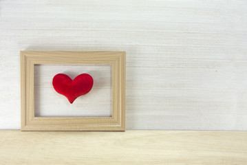 heart in wood frame