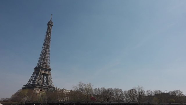 Leaving Eiffel Tower behind, smooth shot - 60fps. Eiffel Tower shot from a boat in the Seine river. Smooth tracking shot - 1080p