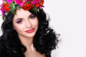 beautiful girl in a wreath of orchids
